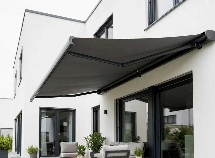 Folding-arm awning shading a small patio at a renovated Birdhaven, Johannesburg home